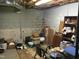Unfinished basement showing concrete block wall and evidence of water damage at 4024 Rural Retreat Rd, Burlington, NC 27215