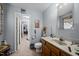 Bathroom featuring a single sink vanity and a connected room, offering functionality at 4024 Rural Retreat Rd, Burlington, NC 27215
