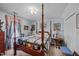 Spacious bedroom with a four-poster bed, offering a cozy and traditional atmosphere at 4024 Rural Retreat Rd, Burlington, NC 27215