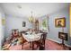 Formal dining room with a table set for a meal and a vintage chandelier at 4024 Rural Retreat Rd, Burlington, NC 27215