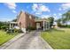 Brick home featuring a covered front porch with stately white columns at 4024 Rural Retreat Rd, Burlington, NC 27215