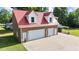 Spacious three-car garage with a red roof and ample parking space at 4024 Rural Retreat Rd, Burlington, NC 27215