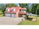 Detached garage with red roof, white trim, two bay doors, and carport at 4024 Rural Retreat Rd, Burlington, NC 27215