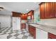 Kitchen featuring rich wood cabinetry, stone countertops, and stainless steel appliances at 4024 Rural Retreat Rd, Burlington, NC 27215