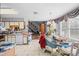 A spacious kitchen featuring natural lighting, white cabinets, and a cozy adjacent dining area at 4024 Rural Retreat Rd, Burlington, NC 27215