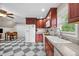 Kitchen featuring rich wood cabinetry, stone countertops, and stainless steel appliances at 4024 Rural Retreat Rd, Burlington, NC 27215