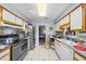 Functional kitchen with stainless steel appliances and views into the dining room at 4024 Rural Retreat Rd, Burlington, NC 27215