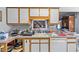 Traditional kitchen showcasing a window over sink, a functional layout, and ample cabinet space at 4024 Rural Retreat Rd, Burlington, NC 27215