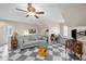Cozy living room features checkerboard floor, seating, and a unique glass-top coffee table at 4024 Rural Retreat Rd, Burlington, NC 27215