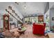 Inviting living room featuring hardwood floors, a cozy seating area, and staircase at 4024 Rural Retreat Rd, Burlington, NC 27215