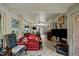 Bright living room with tile floors, large windows, and comfortable seating arrangement at 4024 Rural Retreat Rd, Burlington, NC 27215