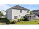 Charming back exterior view featuring a screen porch, neutral siding, and a black fence at 408 Torwood Cir, Apex, NC 27523