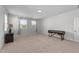 Bright bedroom featuring neutral walls, a side table with lamp, and two large windows for natural light at 408 Torwood Cir, Apex, NC 27523