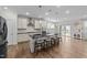 Gourmet kitchen featuring an island with barstool seating, stainless steel appliances, and modern finishes at 408 Torwood Cir, Apex, NC 27523