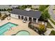 Community pool offers a place for relaxation with chairs, tables, and grilling area nearby at 408 Torwood Cir, Apex, NC 27523