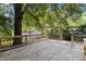 Spacious wooden deck overlooking a leafy and private backyard setting at 409 N Hyde Park Ave, Durham, NC 27703