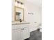Stylish bathroom features granite vanity top and black fixtures at 409 N Hyde Park Ave, Durham, NC 27703