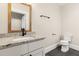 Stylish bathroom features granite vanity top and black fixtures at 409 N Hyde Park Ave, Durham, NC 27703