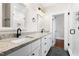 Elegant bathroom features a granite countertop and stylish fixtures and a tiled shower at 409 N Hyde Park Ave, Durham, NC 27703