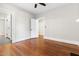 Bedroom with hardwood floors, neutral paint, and ceiling fan at 409 N Hyde Park Ave, Durham, NC 27703