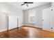 Bedroom with hardwood floors, neutral paint, and ceiling fan at 409 N Hyde Park Ave, Durham, NC 27703