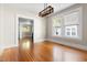 Dining area with hardwood floors, natural light, and a view to adjacent living spaces at 409 N Hyde Park Ave, Durham, NC 27703