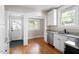 Bright kitchen features stainless steel appliances, granite countertops, and hardwood floors at 409 N Hyde Park Ave, Durham, NC 27703
