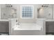 Relaxing bathroom featuring a large soaking tub and double sink vanities at 41 Tan Oak Dr, Selma, NC 27576