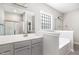 Elegant bathroom with dual vanities, a soaking tub, and a separate walk-in shower at 41 Tan Oak Dr, Selma, NC 27576