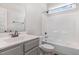Bright bathroom featuring a single sink vanity, a toilet, and a shower tub combo at 41 Tan Oak Dr, Selma, NC 27576