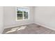 Bright bedroom with a window view, neutral walls, carpet, and natural light at 41 Tan Oak Dr, Selma, NC 27576