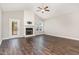 Spacious living room with hardwood floors, a fireplace, and a view to the back deck at 41 Tan Oak Dr, Selma, NC 27576