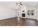 Living room featuring hardwood floors, a fireplace, and a ceiling fan at 41 Tan Oak Dr, Selma, NC 27576
