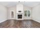 Spacious living room with hardwood floors, a fireplace, and a view to the back deck at 41 Tan Oak Dr, Selma, NC 27576