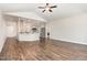 Spacious living room flows into kitchen, featuring wood floors and vaulted ceiling at 41 Tan Oak Dr, Selma, NC 27576