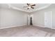 Spacious main bedroom featuring plush carpet, trey ceiling, and ensuite bathroom at 41 Tan Oak Dr, Selma, NC 27576