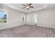 Bright and airy main bedroom featuring plush carpet, trey ceiling, and plenty of natural light at 41 Tan Oak Dr, Selma, NC 27576
