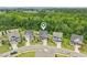 Aerial view of homes in a neighborhood with lush green trees and beautifully landscaped yards at 421 Gilpin Way, Cary, NC 27519