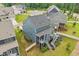 Aerial view showcasing the home's backyard, deck areas, landscaping, and surrounding neighborhood at 421 Gilpin Way, Cary, NC 27519