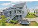 The backyard includes a trampoline and multi-level decks, making it the perfect Gathering entertainment space at 421 Gilpin Way, Cary, NC 27519