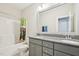 This bathroom has a double vanity, granite countertop, a shower/tub, and a mirror at 421 Gilpin Way, Cary, NC 27519