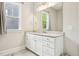 Bathroom featuring white cabinets, granite countertops, and chrome fixtures at 421 Gilpin Way, Cary, NC 27519