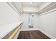 This closet has wood floors and white shelves at 421 Gilpin Way, Cary, NC 27519
