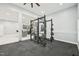 Home gym equipped with workout equipment, neutral paint, and black rubber floor at 421 Gilpin Way, Cary, NC 27519