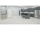 Kitchen featuring grey cabinetry, stainless steel appliances, and granite countertops at 421 Gilpin Way, Cary, NC 27519