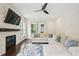 Comfortable living room with a stone fireplace, hardwood floors, ample seating, and plenty of natural light at 421 Gilpin Way, Cary, NC 27519