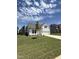 Charming two-story home with a well-manicured lawn and a long concrete driveway leading to the attached garage at 468 Winding Creek Dr Dr, Lillington, NC 27546