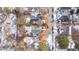 An aerial view of a home showcasing the roof, yard, driveway, and surrounding neighborhood in winter at 507 Price Ave, Durham, NC 27701