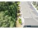 Aerial view showcasing rooftops, manicured landscaping, and outdoor patio areas, creating a serene setting at 5113 Lady Of The Lake Dr, Raleigh, NC 27612