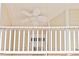 Charming balcony with white railings, offering a glimpse of the outdoors and fresh air at 5113 Lady Of The Lake Dr, Raleigh, NC 27612